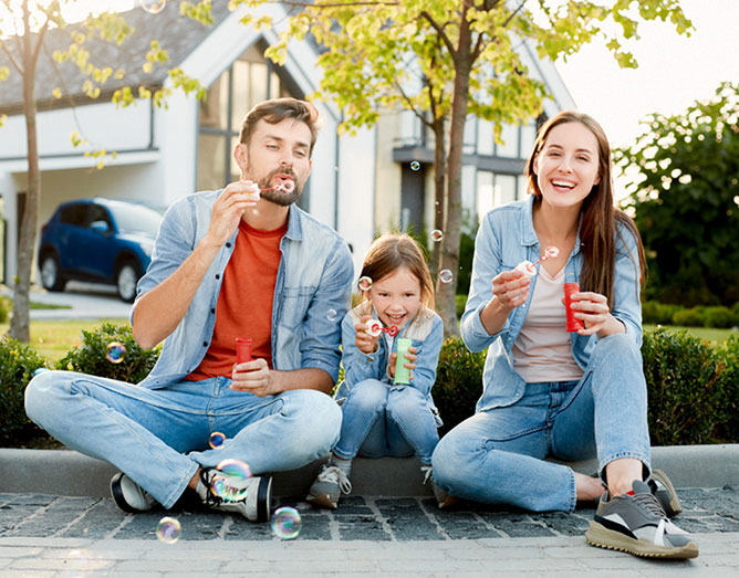 parents with young child in outdoor setting