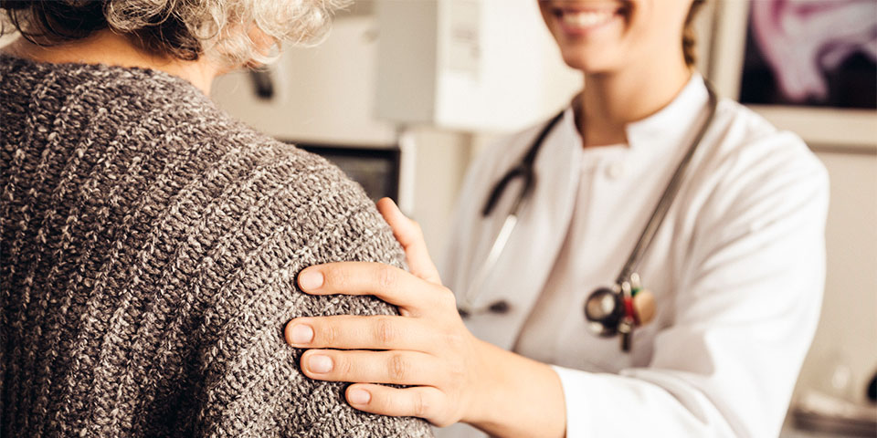 female healthcare worker speaking to adult female patient