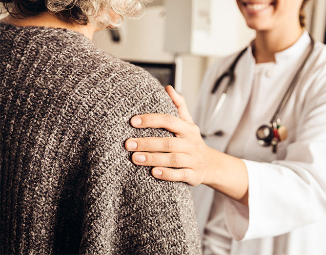 female healthcare worker speaking to adult female patient